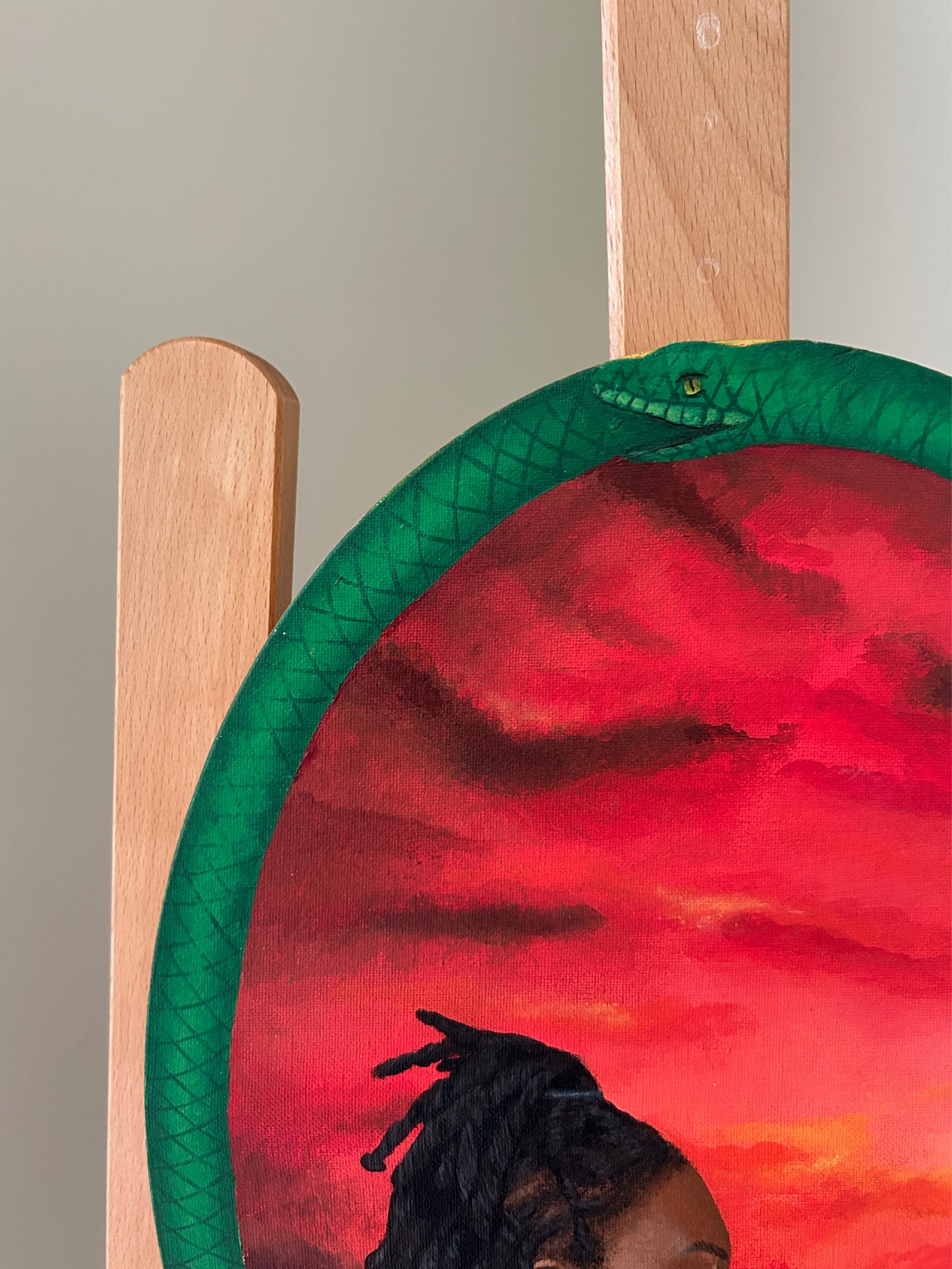 Amber Peeks Art: Artistic painting of a snake coiled around the edges of the canvas. 