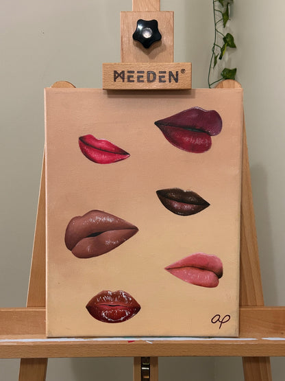 Amber Peeks Art: Canvas painting with lips on a wooden easel.